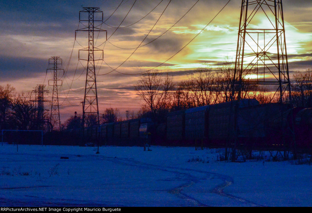 Train passing by at the sunset